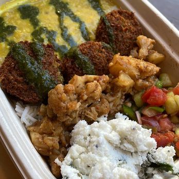 Ambo - Basmati Rice base with Yellow Dal, Falafel, Cauliflower, Cucumber Tomato Salad, Coconut Chutney, and Cilantro Mint Chutney Drizzle. - Indian Near Me - New York, New York Ambo - Basmati Rice base with Yellow Dal, Falafel, Cauliflower, Cucumber Tomato Salad, Coconut Chutney, and Cilantro Mint Chutney Drizzle. - Indian Near Me - New York, New York