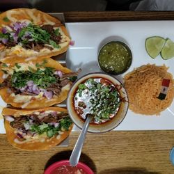 La Cabana - Beef birria tacos served au jus, with Spanish rice and salsa Verde.