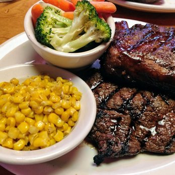Texas Roadhouse - 8 oz steak & ribs w/ 2 sides--$18.99. (3 meals worth) - Steakhouses Near Me - Gainesville, Florida Texas Roadhouse - 8 oz steak & ribs w/ 2 sides--$18.99. (3 meals worth) - Steakhouses Near Me - Gainesville, Florida