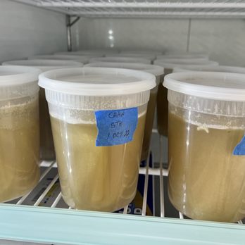 60 & Two - a fridge filled with a variety of liquids - Food Near Me - Cabot, Arkansas