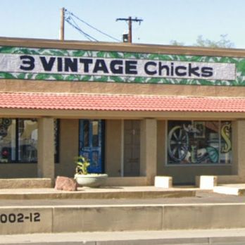 3 Vintage Chicks - Exterior view of the "3 Vintage Chicks" storefront with a large sign, beige walls, and a red-tiled awning, located in a commercial area. - Furniture Stores Near Me - Phoenix, Arizona
