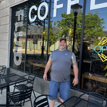 Fluid Coffee Roasters - Hubby outside the shop - Coffee Roasteries Near Me - Michigan City, Indiana