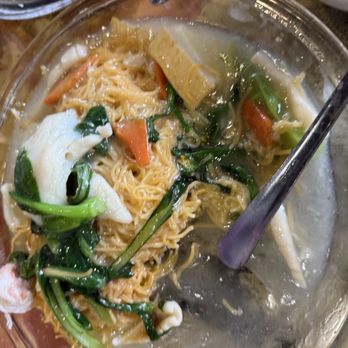 New Village - Seafood Pan Fried noodle. I ate 1 Shrimp, 1 squid, 1 fish cake and a tiny slice of fish fillet. You can see what's left on the plate - Cantonese Near Me - Germantown, Maryland