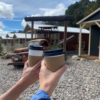 Mt Lemmon Coffee Bean - a person holding two coffee cups - Coffee & Tea Near Me - Mount Lemmon, Arizona