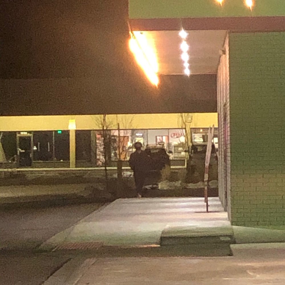 My friends walking to my car from the drive through My friends walking to my car from the drive through