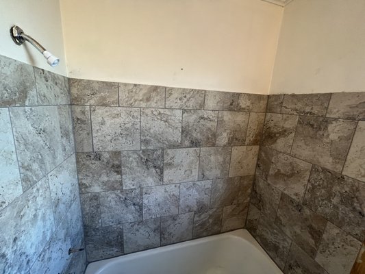 Bath tub tile upgrade - "Transform your bathroom with our expert remodeling services. From modern upgrades to complete makeovers, our team specializes in transforming your bathroom into a luxurious and functional space. Discover top-quality materials, skilled craftsmanship, and personalized design solutions for your dream bathroom. Contact us today for a professional and seamless bathroom remodel experience."