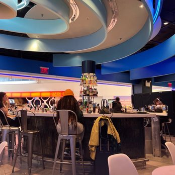 Deep Blue Sushi - a group of people sitting at a bar - Sushi Bars Near Me - Jamaica, New York Deep Blue Sushi - a group of people sitting at a bar - Sushi Bars Near Me - Jamaica, New York