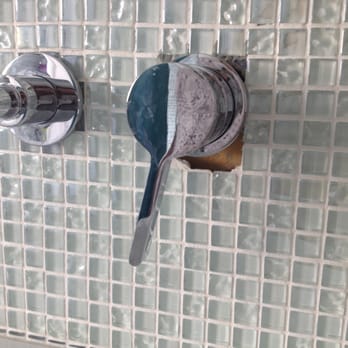 Splash Carpentry - I didn't realize that it wasn't essential to tile ALL THE WAY under the escutcheon plate.  Now I have a hole in my wall. - General Contractors Near Me - Chicago, Illinois