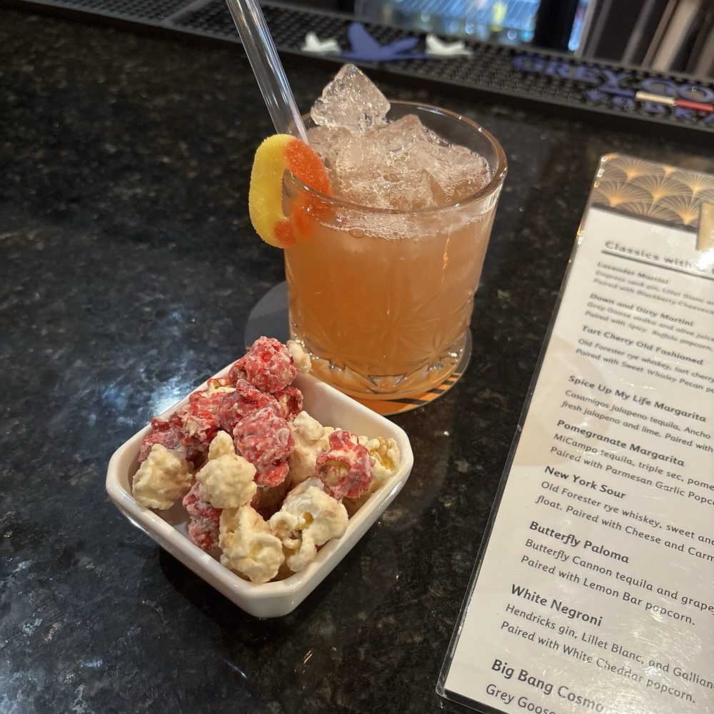Popcorn and Cocktails - Peach drink with Strawberry Cheesecake popcorn - Popcorn Shops Near Me - Omaha, Nebraska Popcorn and Cocktails - Peach drink with Strawberry Cheesecake popcorn - Popcorn Shops Near Me - Omaha, Nebraska