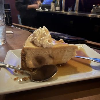 Half Shell Oyster House - Bananas Foster Cheesecake Slice - Seafood Near Me - Gulfport, Mississippi Half Shell Oyster House - Bananas Foster Cheesecake Slice - Seafood Near Me - Gulfport, Mississippi