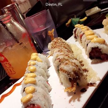 McGuire's Sushi - 2 spicy tuna rolls & a crunchy shrimp roll in the middle--also a dragon punch in the glass jar in the back - Sushi Bars Near Me - Destin, Florida McGuire's Sushi - 2 spicy tuna rolls & a crunchy shrimp roll in the middle--also a dragon punch in the glass jar in the back - Sushi Bars Near Me - Destin, Florida