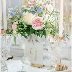 Keepsakes Florist - Weddings by Keepsakes Florist uses the freshest florals. Flower Centerpieces with gold and glass candalabras.