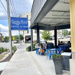 people sitting at tables outside a coffee shop people sitting at tables outside a coffee shop