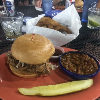 The Blu Pig - Pulled pork sandwich with baked beans and onions rings-delicious! - Barbeque Near Me - Moab, Utah