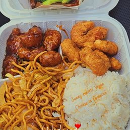 Vegan plate orange nuggets, fried shrimp, chow mein and white rice. Side of broccoli "beef". Vegan plate orange nuggets, fried shrimp, chow mein and white rice. Side of broccoli "beef".