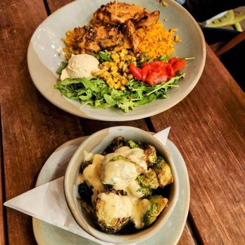 Nando's Peri-Peri - Boneless lemon herb, Peri Peri, chicken thighs with rice and salad and a side of okra. - Chicken Shop Near Me - Addison, Texas