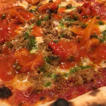 In Riva - Sausage and pepper pizza in front and pepperoni pizza in the back - Italian Near Me - Philadelphia, Pennsylvania