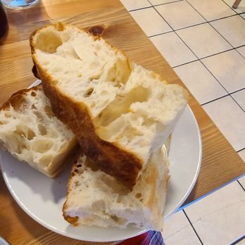Macizo Restaurant - Fresh sourdough bread can be purchased for $10 a loaf. - Peruvian Near Me - Indianapolis, Indiana