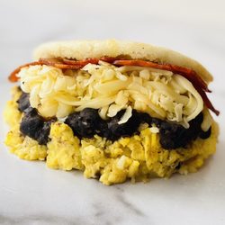 Amara Chocolate & Coffee - Gluten free Arepa All day Brunch! Pal Pana. Black beans, Gouda, Eggs and your choice of Spanish chorizo or Bacon!