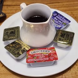Angels Pancake House - Condiments for pancakes. Decent syrup.