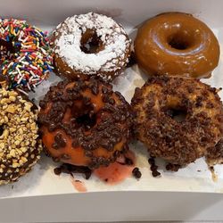 Deep Creek Donuts - Rainbow, smurfette, caramel cove. Rock lodge, the judge, Brenda's country breakfast