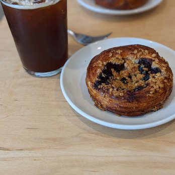 Zion Coffee Bar - Citro Coffee and Blueberry Crumble Danish - Coffee & Tea Near Me - Peoria, Illinois Zion Coffee Bar - Citro Coffee and Blueberry Crumble Danish - Coffee & Tea Near Me - Peoria, Illinois