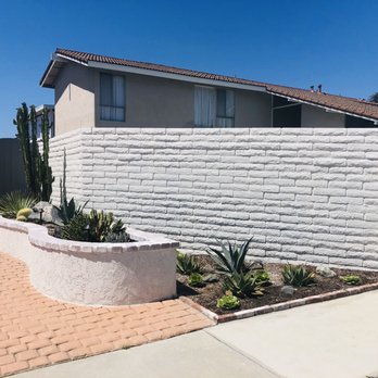 Greener Gardens - Front yard planter. An old Oleander brush was in the front brick wall. It took the guys 4 hours to remove due to the roots. - Landscaping Near Me - Huntington Beach, California Greener Gardens - Front yard planter. An old Oleander brush was in the front brick wall. It took the guys 4 hours to remove due to the roots. - Landscaping Near Me - Huntington Beach, California