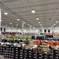 DSW Designer Shoe Warehouse - Large building with a lot of shoes.