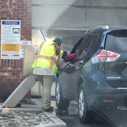 QuickChek - Cashier helping a customer pay for the car wash.