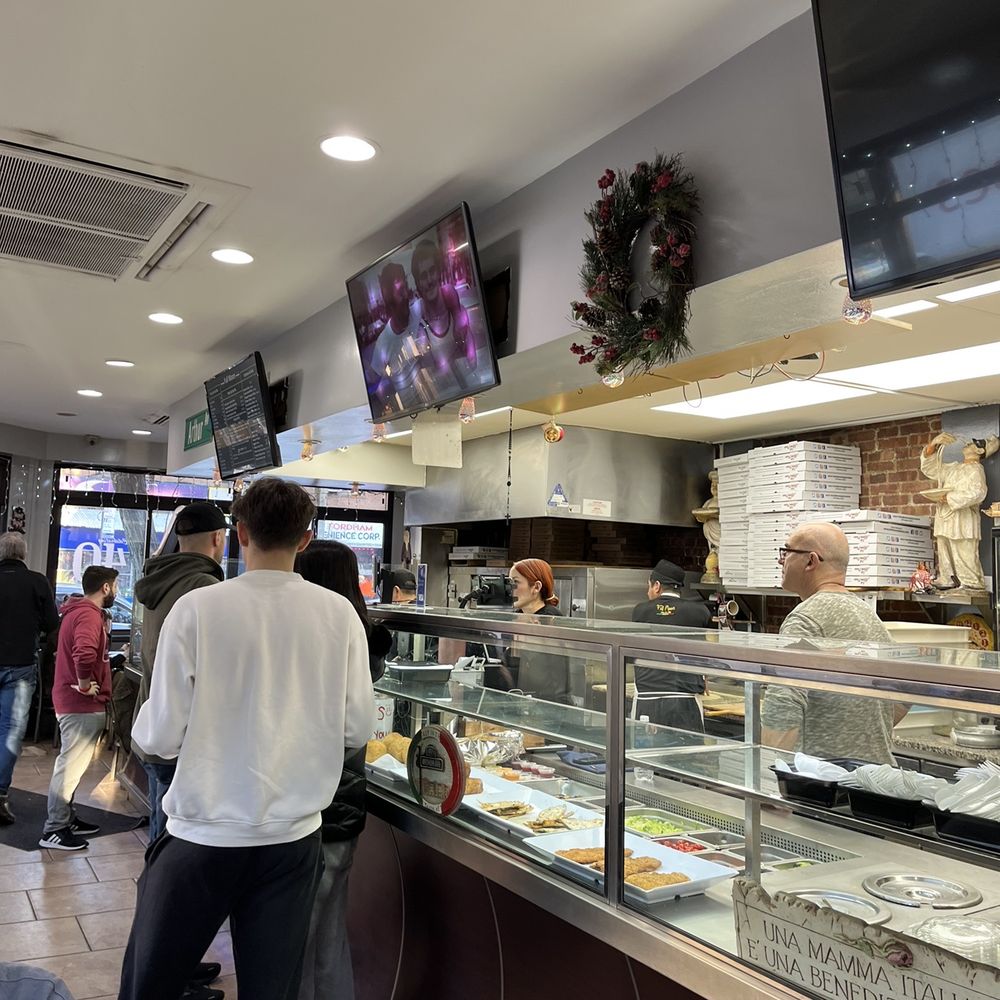 Mezza Luna Pizza - customers at the counter - Pizza Near Me - Bronx, New York Mezza Luna Pizza - customers at the counter - Pizza Near Me - Bronx, New York