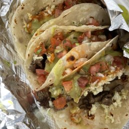 4 Asada tacos with everything on it 4 Asada tacos with everything on it