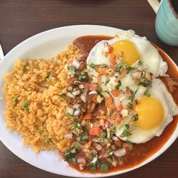 Tamales Guadalajara - Costillas with Nopales, served with two sunny side up eggs on top, pico de gallo, and Spanish rice, with a side of black coffee