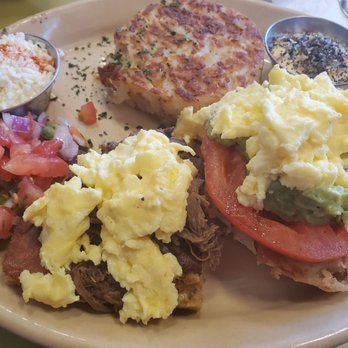 Snooze, an A.M. Eatery - Tamale and English Muffin eggs Benedict with hollandaise on the sides - Breakfast & Brunch Near Me - Austin, Texas Snooze, an A.M. Eatery - Tamale and English Muffin eggs Benedict with hollandaise on the sides - Breakfast & Brunch Near Me - Austin, Texas