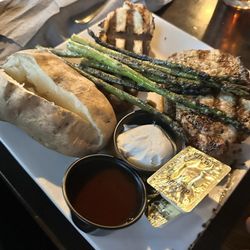 Carl & 'Chelle's Grill Room - Grilled pork chops with asparagus, baked potato and grilled bread.