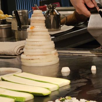 Teppan Edo - a chef preparing food in a kitchen - Japanese Near Me - Lake Buena Vista, Florida