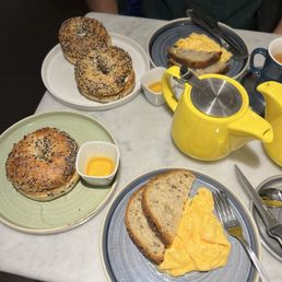 Scrambled eggs, bagel with cream cheese & side of honey, jasmine tea Scrambled eggs, bagel with cream cheese & side of honey, jasmine tea