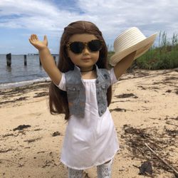 Photo i took of my doll standing in the sand