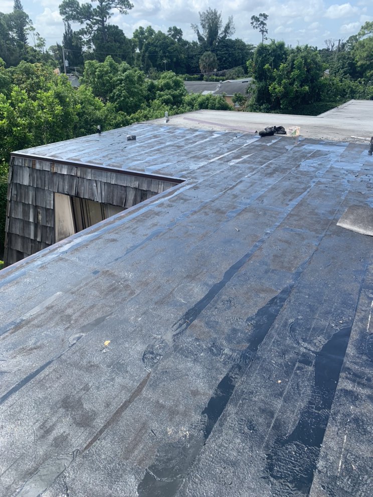 Slide of Louis Roofing