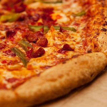 Mario's Pizza - a close up of a pizza - Pizza Near Me - South Daytona, Florida Mario's Pizza - a close up of a pizza - Pizza Near Me - South Daytona, Florida