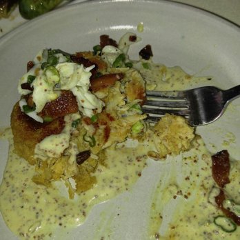 Rainbow Lodge - Crab cake with Dijon mustard and crispy bacon - New American Near Me - Houston, Texas Rainbow Lodge - Crab cake with Dijon mustard and crispy bacon - New American Near Me - Houston, Texas