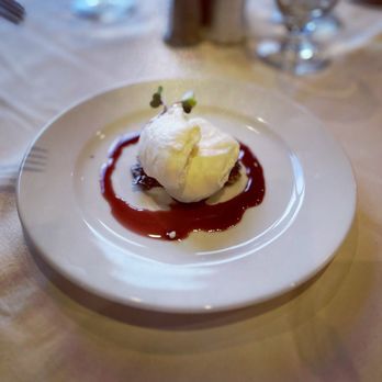 Mural Room - Their cheesecake which was very unique - granola crust topped with some kind of whipped yogurt and a cherry sauce around it - it was good - American Near Me - Moran, Wyoming