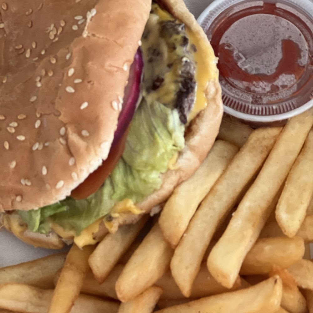 Plan B - Picture of the cheeseburgers. The bun is moved to see the meat - Sports Bars Near Me - Rosarito, BCN Plan B - Picture of the cheeseburgers. The bun is moved to see the meat - Sports Bars Near Me - Rosarito, BCN
