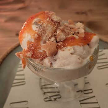 Cane Pazzo - Peach swirl gelato with cookie crumble topping. - Italian Near Me - Hanahan, South Carolina