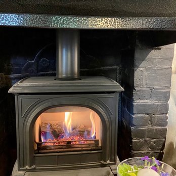 Kinghams Restaurant - Warm fire in dining room - British Near Me - Guildford, SRY