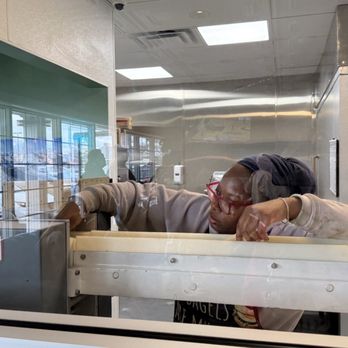Tahoe Bagel - Adding the dough to the machine - Bagels Near Me - Reno, Nevada Tahoe Bagel - Adding the dough to the machine - Bagels Near Me - Reno, Nevada