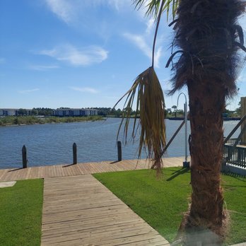 The Blue Crab - The walkway by the water with my condo in the background - Seafood Near Me - Slidell, Louisiana The Blue Crab - The walkway by the water with my condo in the background - Seafood Near Me - Slidell, Louisiana