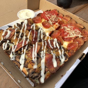8Mile Detroit Style Pizza - The lefthand side is the Dodi Pie which includes Spicy Soppressata, Caramelized Onions, and Mushrooms. Right is the Pepperoni Pie they make. - Pizza Near Me - Toronto, Ontario