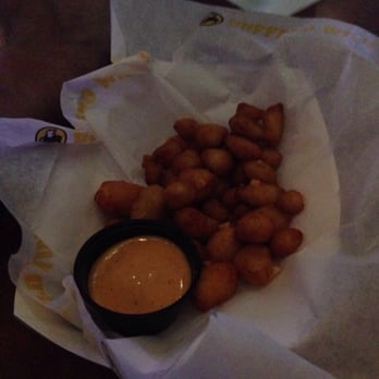 Buffalo Wild Wings - Compared to my husband's hand in the background $6 of nothing. - Chicken Wings Near Me - Tucson, Arizona