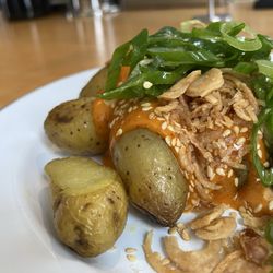 Quinnie's - SPICY POTATOES $8 Roasted Fingerling potatoes with gochujang mayo, sesame, crispy fried shallots + scallions. (vegetarian)