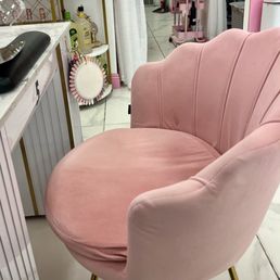 Seated in this cute pink seat. Seated in this cute pink seat.